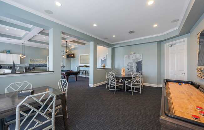 a game room with a ping pong table and a pool table