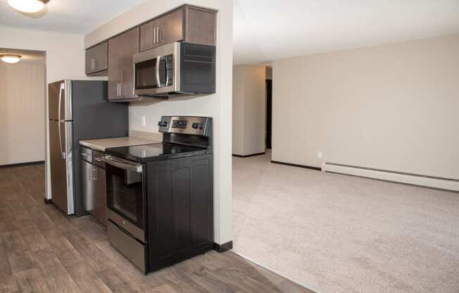 upgraded kitchen with slate cabinets, full stainless steel appliance package