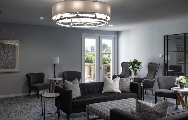 a living room filled with furniture and a flat screen tv