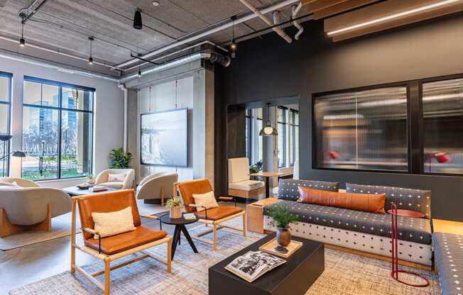 a living room with couches chairs and a table