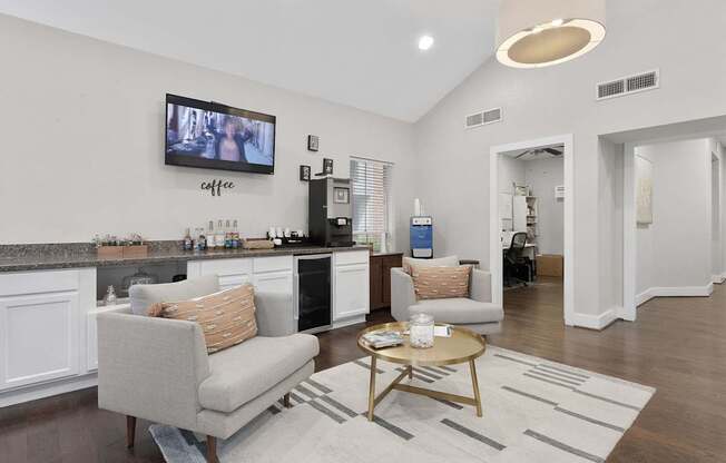 A living room with a grey couch and a coffee table.