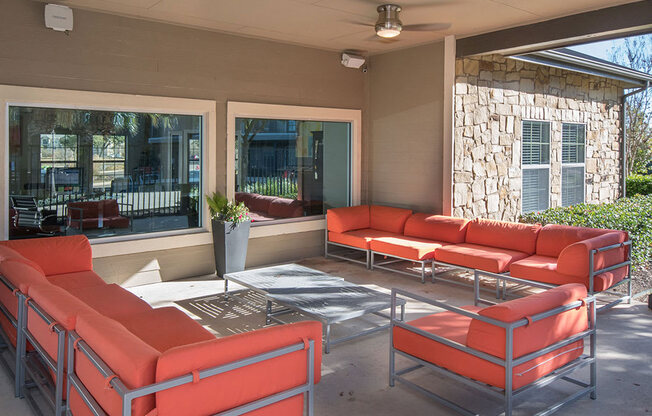 Room with red sofas at The Palmera on 3009, Texas, 78154