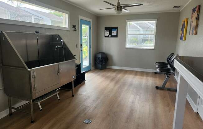 a living room with a surgery room and a surgery table in the corner