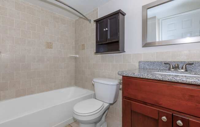 a bathroom with a toilet sink and bathtub