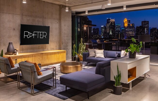 Clubroom seating and minneapolis skyline at night time