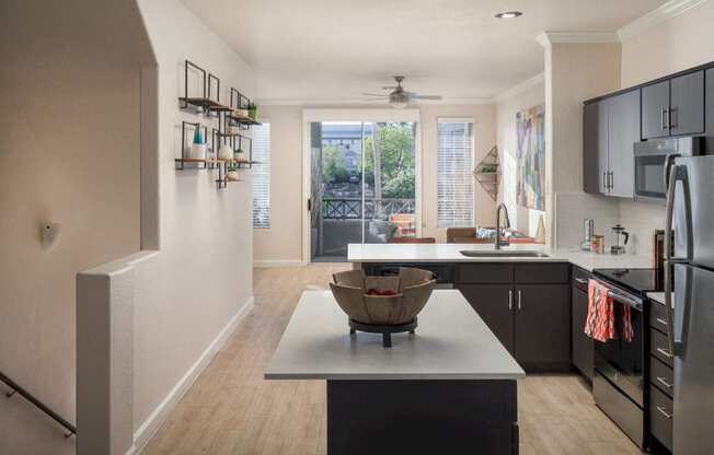 Model kitchen with island and white quartz cabinets