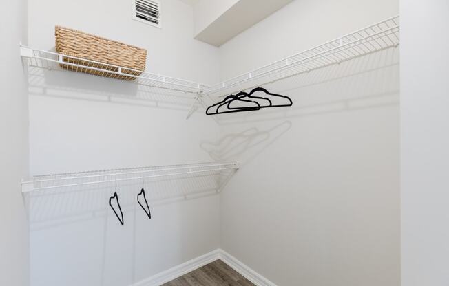 a spacious walk in closet with white walls and a ceiling with a vent at Heritage Bay, Florida