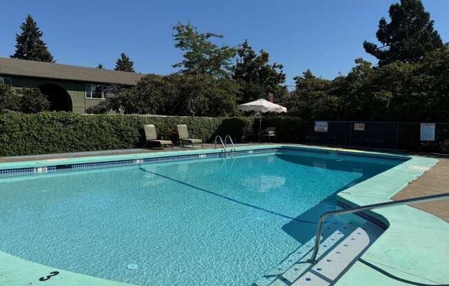 The Clairmont Apartments in Eugene, Oregon Pool with Lounge Chairs