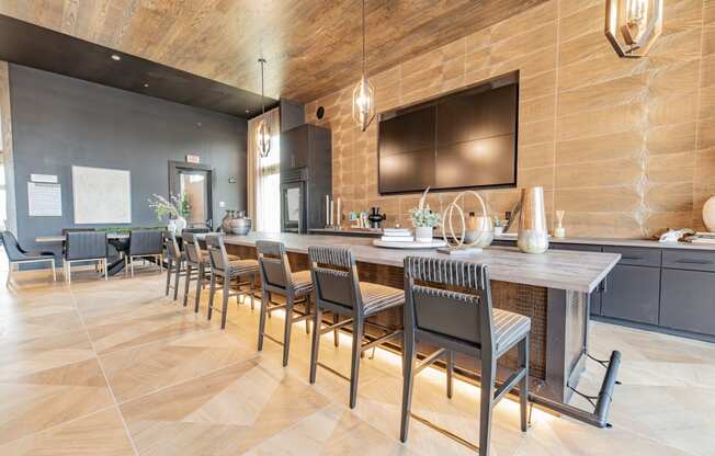 a large kitchen with a long table and chairs