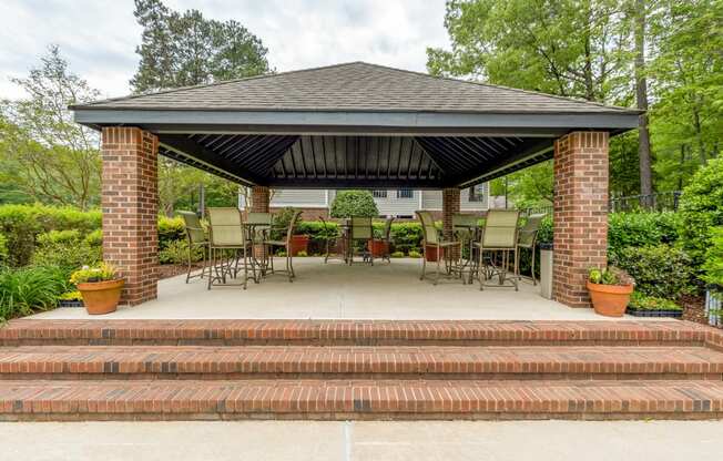 a gazebo with chairs and a table on a patio at Brampton Moors, Cary, NC, 27513
