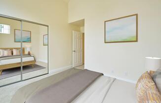 a bedroom with a bed in a room