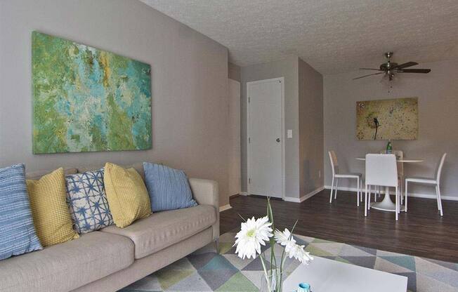 Modern spacious living room with wood style flooring at Camelot East Apartments, Fairfield, OH