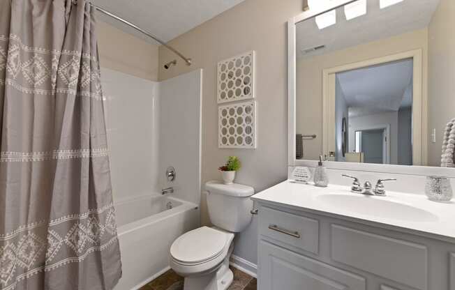 Second bathroom with clean white vanity and large soaking tub at The Reserves of Thomas Glen, Shepherdsville, KY, 40165