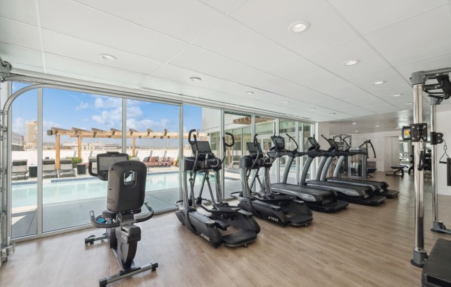 fitness center with cardio machines at One Santa Fe apartments