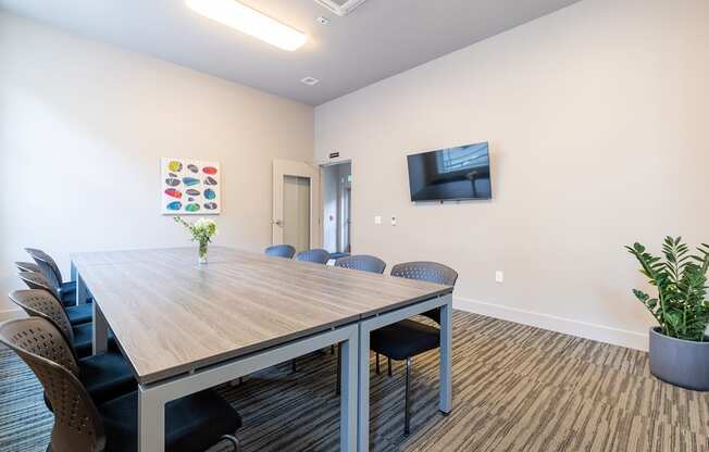 Conference Room with TV, desk and chairs