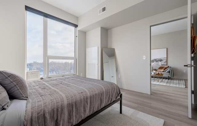 Queen bed with Cleveland city views at TREO Apartments, Cleveland