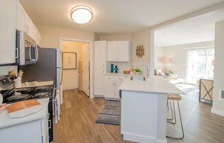 a kitchen with white cabinets and a white counter top at The Arden Apartments, Gresham, 97080