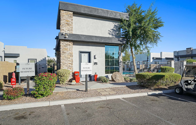 the front of a building with a parking lot and a sign that reads center services