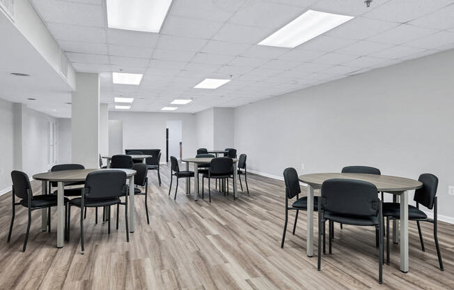 a large room with tables and chairs in it