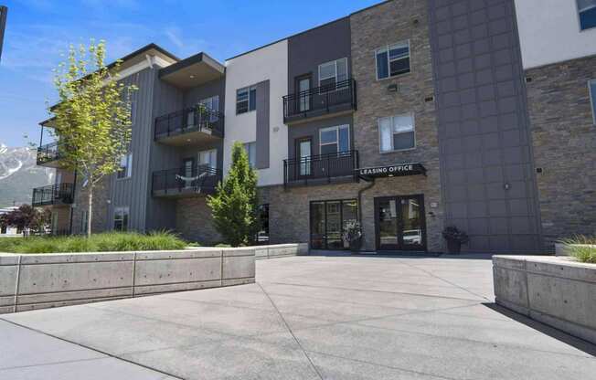 a view of the front of the building at The Flats at Riverwoods, Provo, Utah