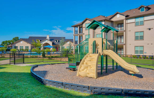 A playground for children at Parc at Bentonville Apartments in Bentonville, AR