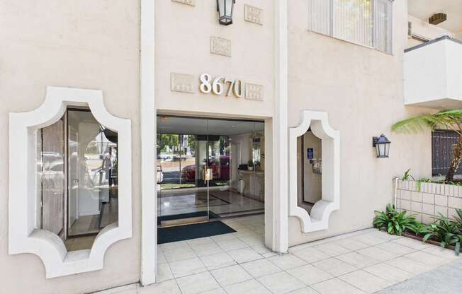 The image shows the front of a building with the number 8670 on it.