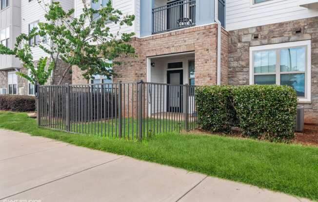 our apartments have a wrought iron fence in front of our building