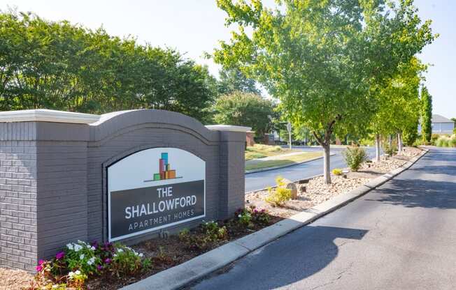 the sign for the shallows at the entrance to the subdivision with trees at The Shallowford, Chattanooga, TN