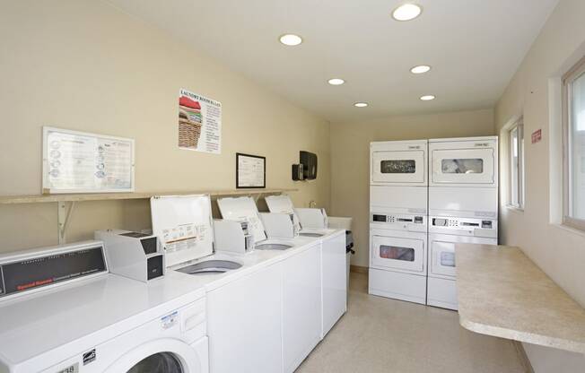 A laundry room with a washer and dryer in it.