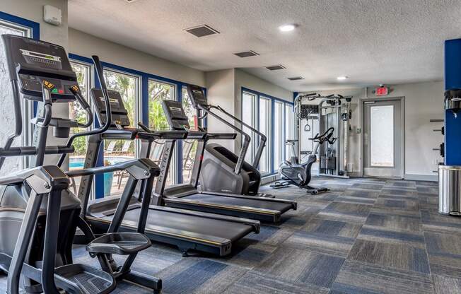 the gym with cardio equipment at the monarch luxury apartments in midtown