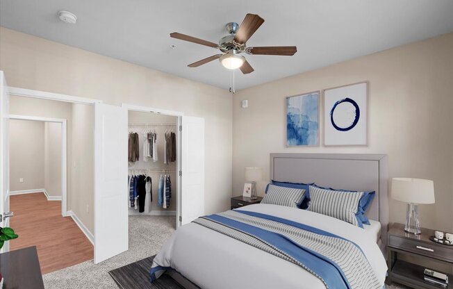 a bedroom with a large bed and a ceiling fan at The Dorset, Kansas City, Missouri