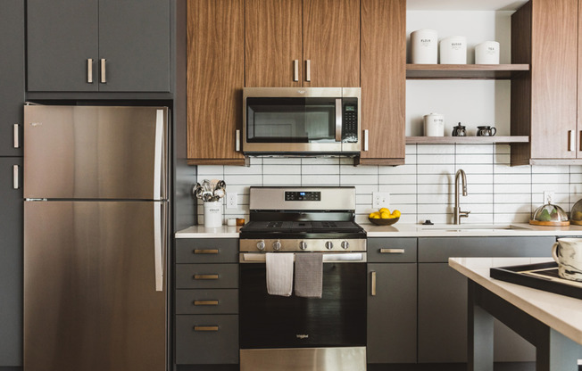 Kitchens with chef-islands, two-toned cabinetry with chrome pulls