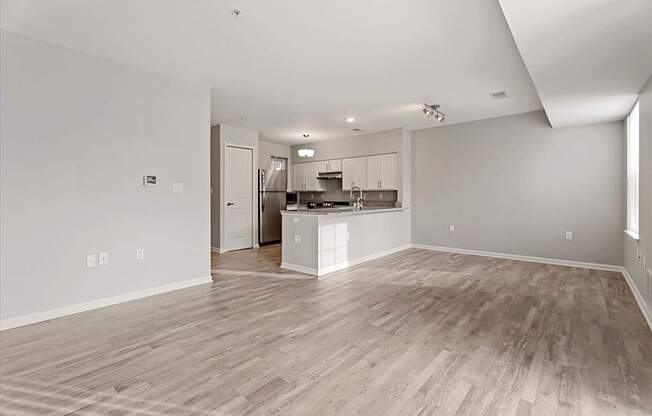 A spacious kitchen with a bar counter and a dining area.