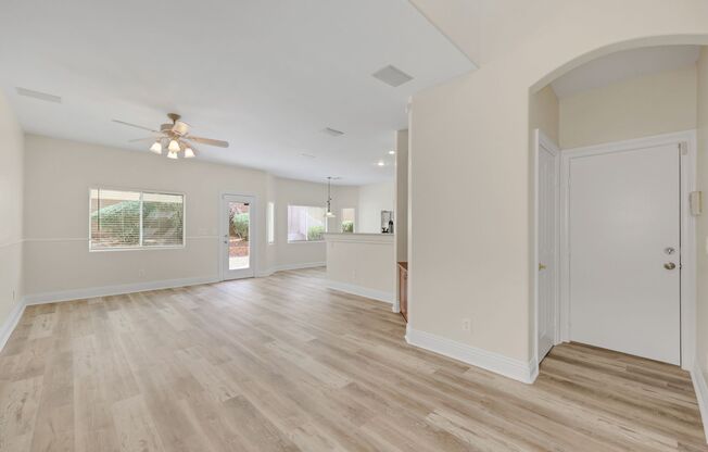 Gorgeous home with new flooring throughout and a Community Pool!