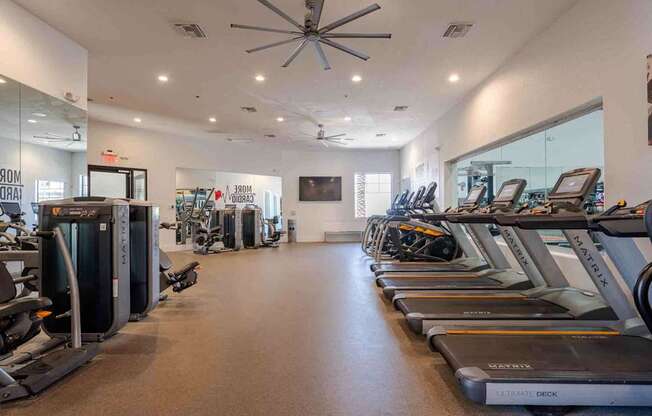 A gym with treadmills and exercise equipment.