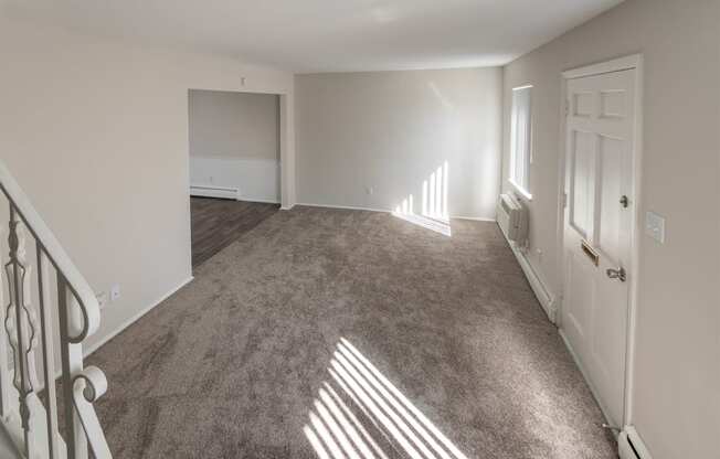 This is a photo of the living room of the 1004 square foot, 2 bedroom/1 bath Townhome with stackable washer/dryer floor plan at Colonial Ridge Apartments in the Pleasant Ridge neighborhood of Cincinnati, OH.