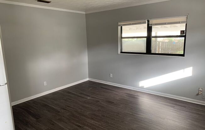 Large, spacious 4/2 w/ BONUS room. New paint and flooring throughout!