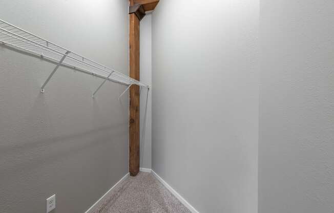 a spacious closet in a bedroom with a mirrored closet door