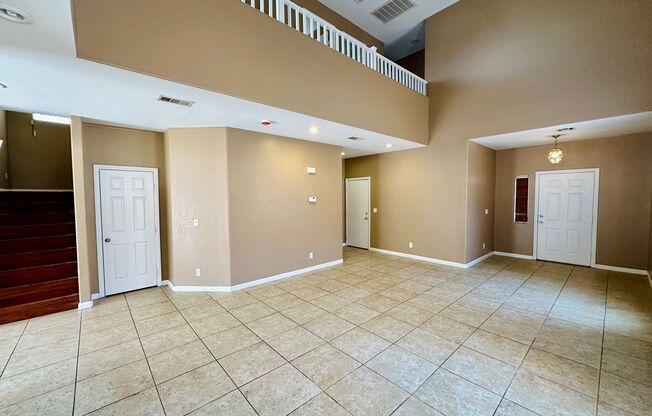 Spacious family home near Silverado Ranch park with 5 bedrooms and one bed & bath downstairs!