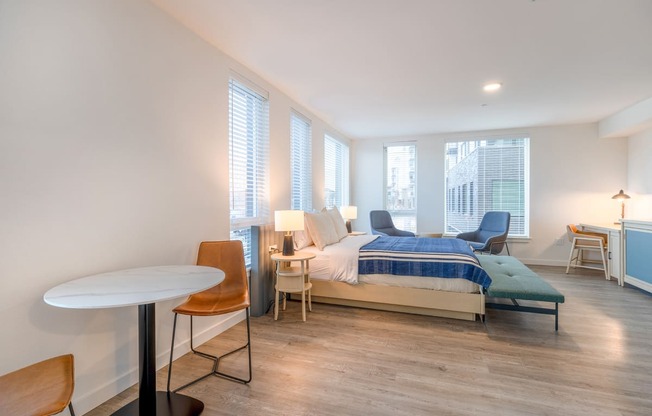 a bedroom with a bed and a desk in a room at Marina Square, WA 98337