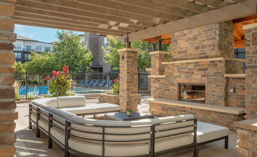 Poolside lounge with outdoor fireplace