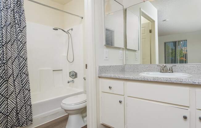 Bathroom with sink, toilet and shower at Woodbend, California, 91701