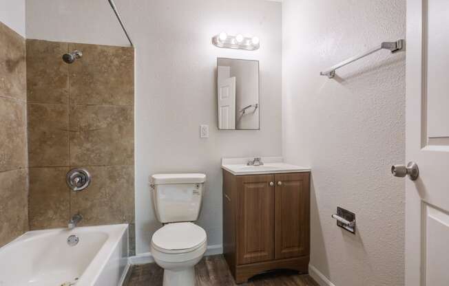 a bathroom with a toilet sink and bathtub