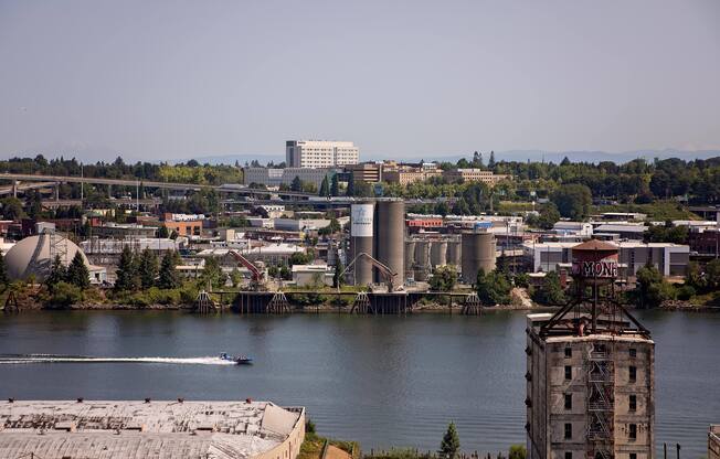 a boat in the water near a river and a city