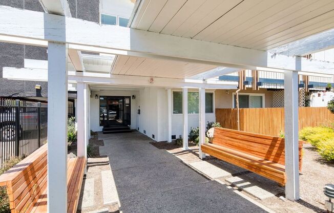 a building with a wooden bench in front of it