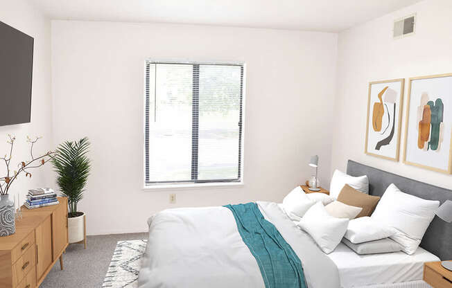 Bedroom with a window in it at Seville Apartments in Kalamazoo, MI 49009