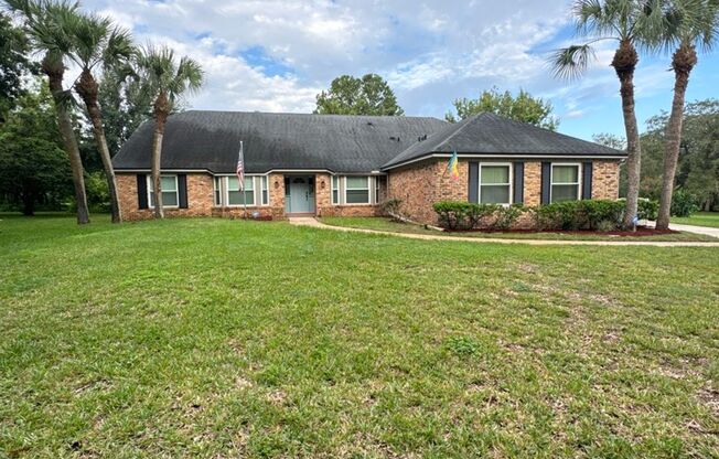 Charming 4-Bedroom Oasis with Pool and Fireplace in Willow Wind Community! Lawn Care & Pool Maintenance is included! WASHER AND DRYER INCLUDED!