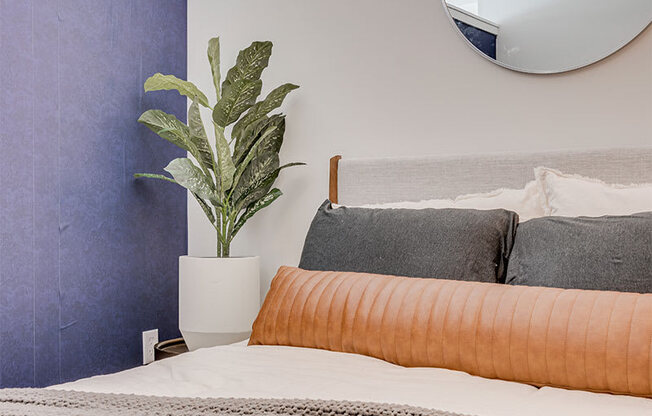 Bedroom with large bed and mirror