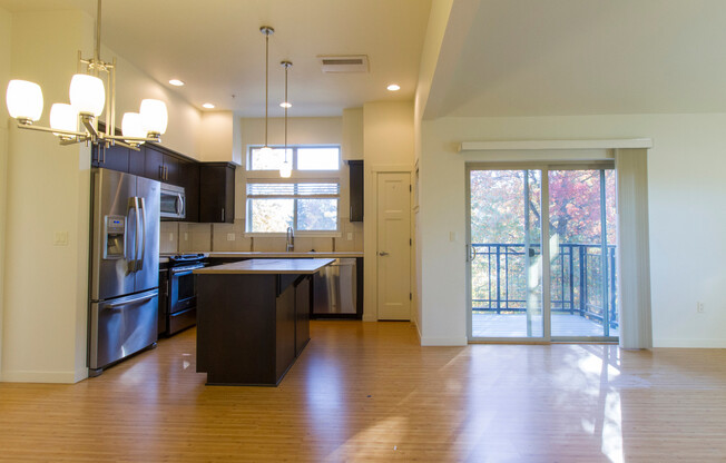 **Move in special of 50% off the first month's rent!** Incredible Top Floor Unit with Parking, Balcony, Community Pool, & Laundry in Unit