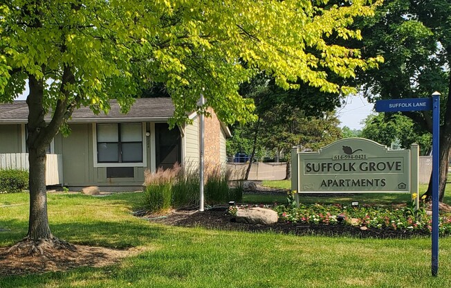 a building with a sign that says suffolk grove apartments